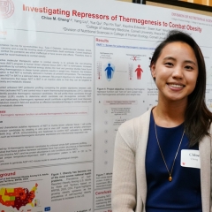 a young woman, Chloe Cheng, standing proudly beside her research poster at a scientific conference